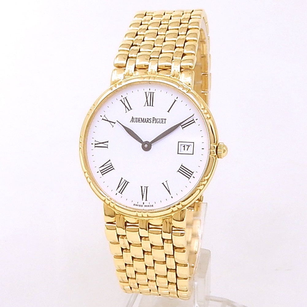 Audemars Piguet Classic Ultra Slim 18k Yellow Gold White Dial: This elegant Audemars Piguet Classic Ultra Slim represents the pinnacle of minimalist luxury. Crafted in a radiant 18k yellow gold case, it features a refined white dial with a date complication and i