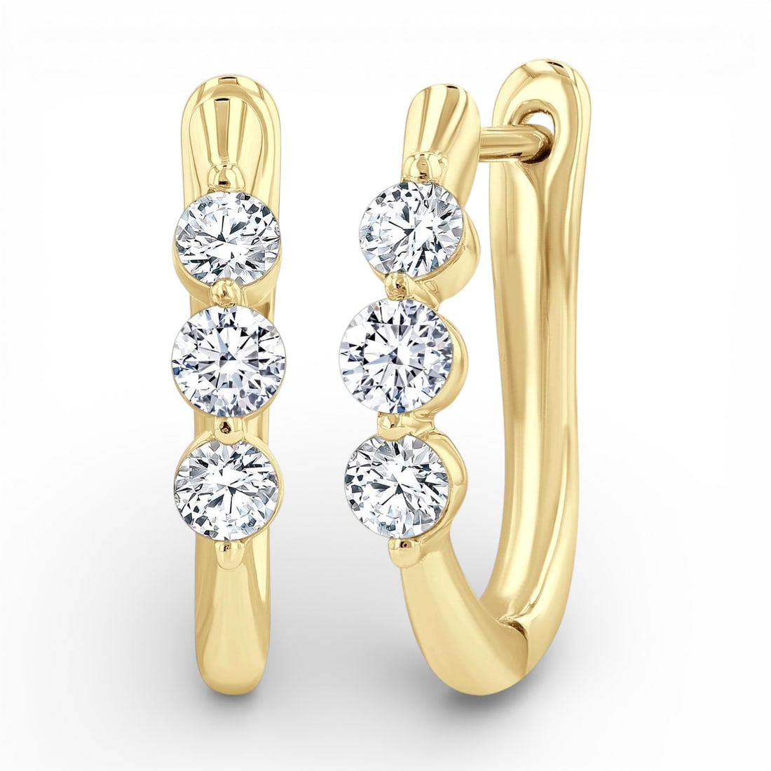 0.50 ctw 3-Stone Round Diamond Fashion Hoop 14K Yellow Gold Earrings: Captured in a moment of brilliance, this elegant Hoop pair of earrings featuring White Diamonds speaks to the connoisseur. Securely held in a classic Three-Stone design, the earrings are forged from 2
