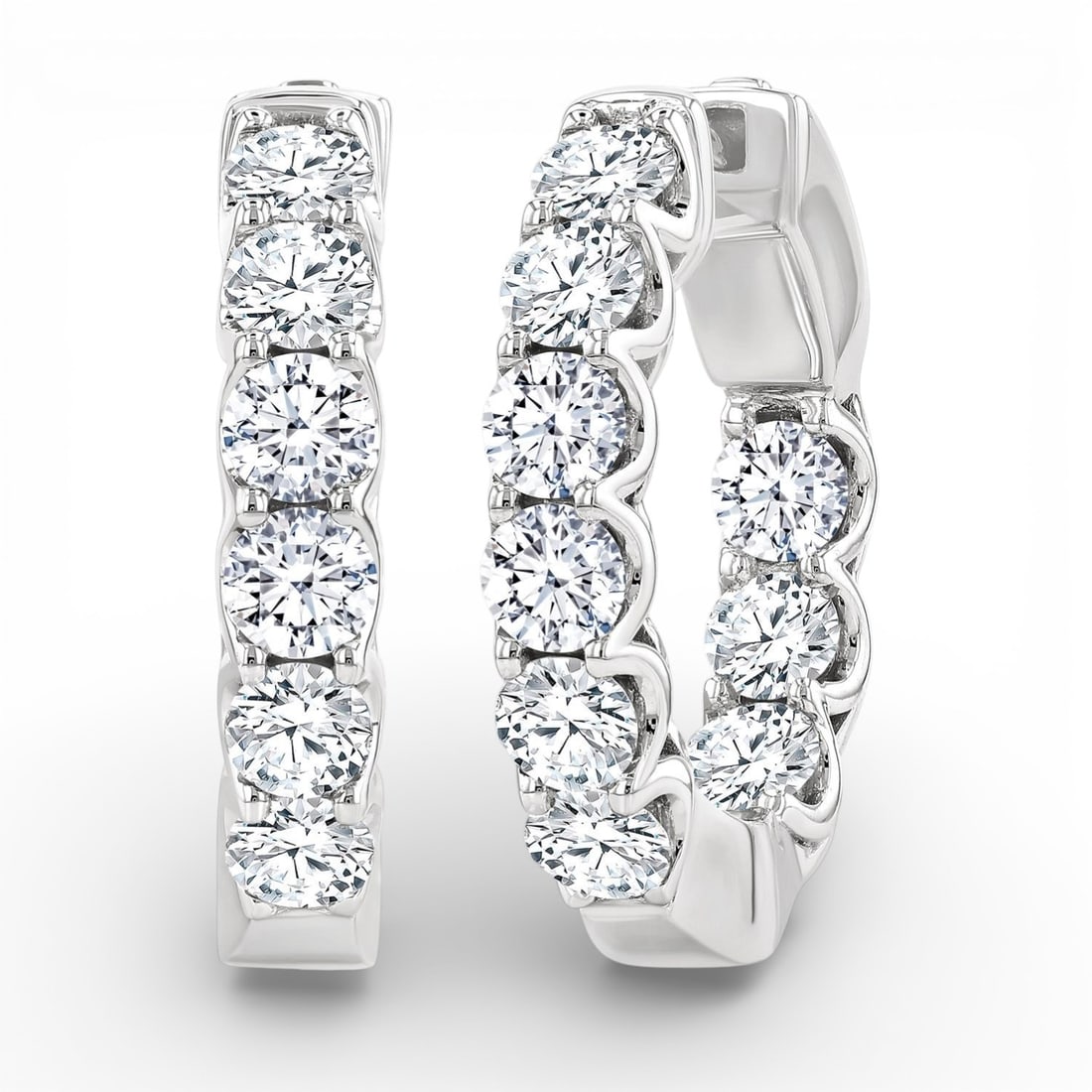 3.02 ctw Round Diamond 14K White Gold Hoop Earrings: Epitomizing grandeur, this exquisite Inside-Out Hoop pair of earrings featuring White Diamond stands as a beacon of refined taste. A detailed Inside-Out Hoop setting secures the stones, rendered in 10