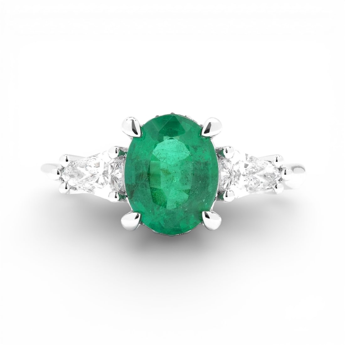 Oval Emerald, Diamond, and 0.59 ctw Diamond Accent Platinum Ring: Captured in a moment of brilliance, this stunning 3-Stone ring featuring Emerald, White Diamond speaks to the connoisseur. Expertly mounted in a Three-Stone setting, the ring is crafted in 5.85 grams 
