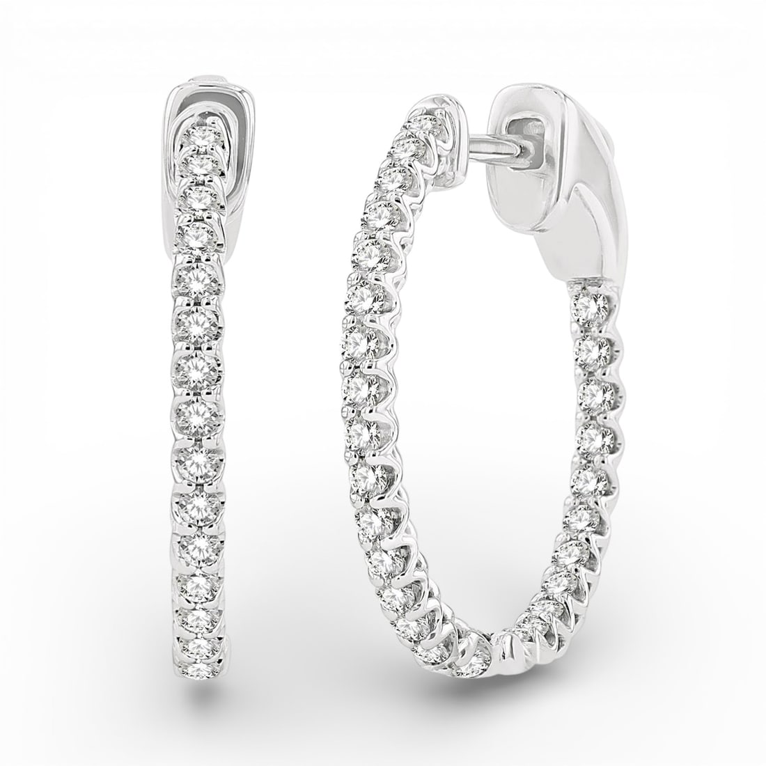 0.53 ctw Diamond Inside-Out Hoop 14K White Gold Earrings: A symphony of light and color, this stunning Inside-Out Hoop pair of earrings featuring White Diamond embodies the pinnacle of luxury. Expertly mounted in a Inside-Out Hoop setting, the earrings are c