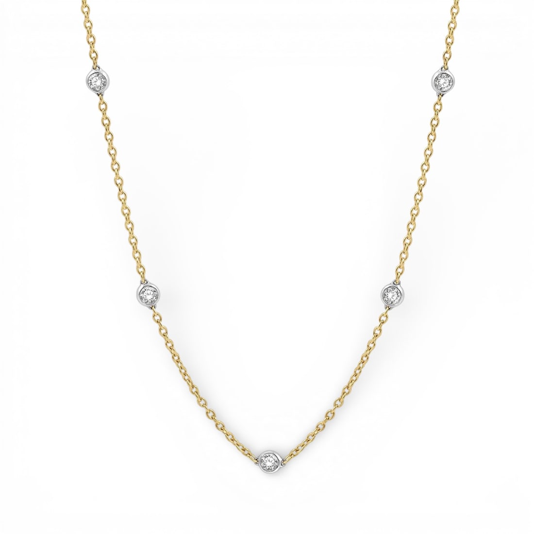 2.04 ctw Diamond Station 14K Yellow & White Gold Necklace: Epitomizing grandeur, this elegant Station necklace featuring White Diamond stands as a beacon of refined taste. Showcasing the gems in a Bezel arrangement, the necklace consists of 3.95 grams of 14K 