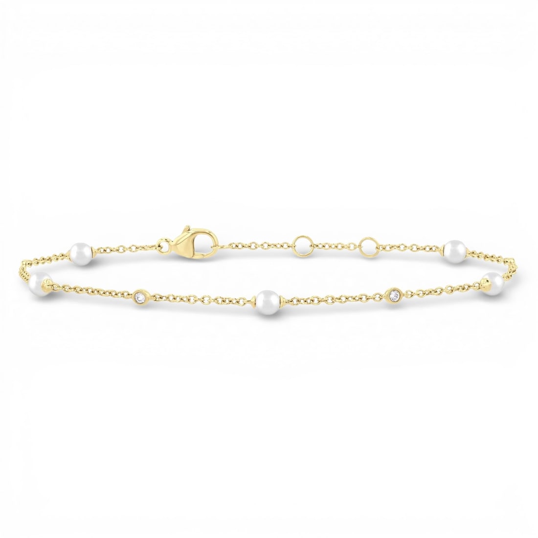 3mm Cultured Pearl and 0.07 ctw Diamond 14K Yellow Gold Bracelet: Epitomizing grandeur, this elegant Station bracelet featuring Cultured Pearl, White Diamond stands as a beacon of refined taste. Showcasing the gems in a Station arrangement, the bracelet consists of 