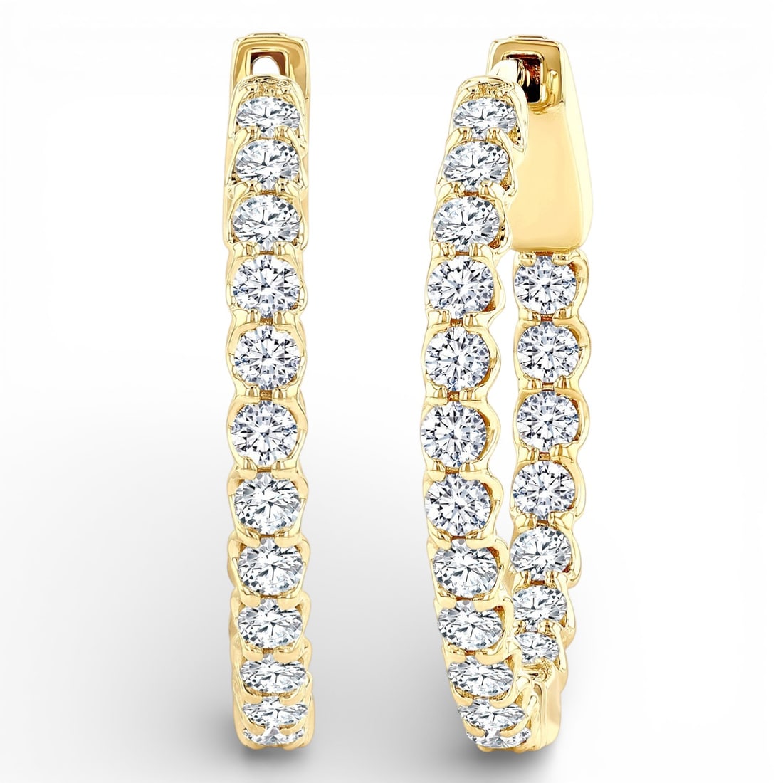 1.03 ctw White Diamond 14K Yellow Gold Hoop Earrings: Defining modern elegance, this stunning Hoop pair of earrings featuring White Diamond captures the essence of style. Securely held in a classic Hoop design, the earrings are forged from 4.2 grams of h