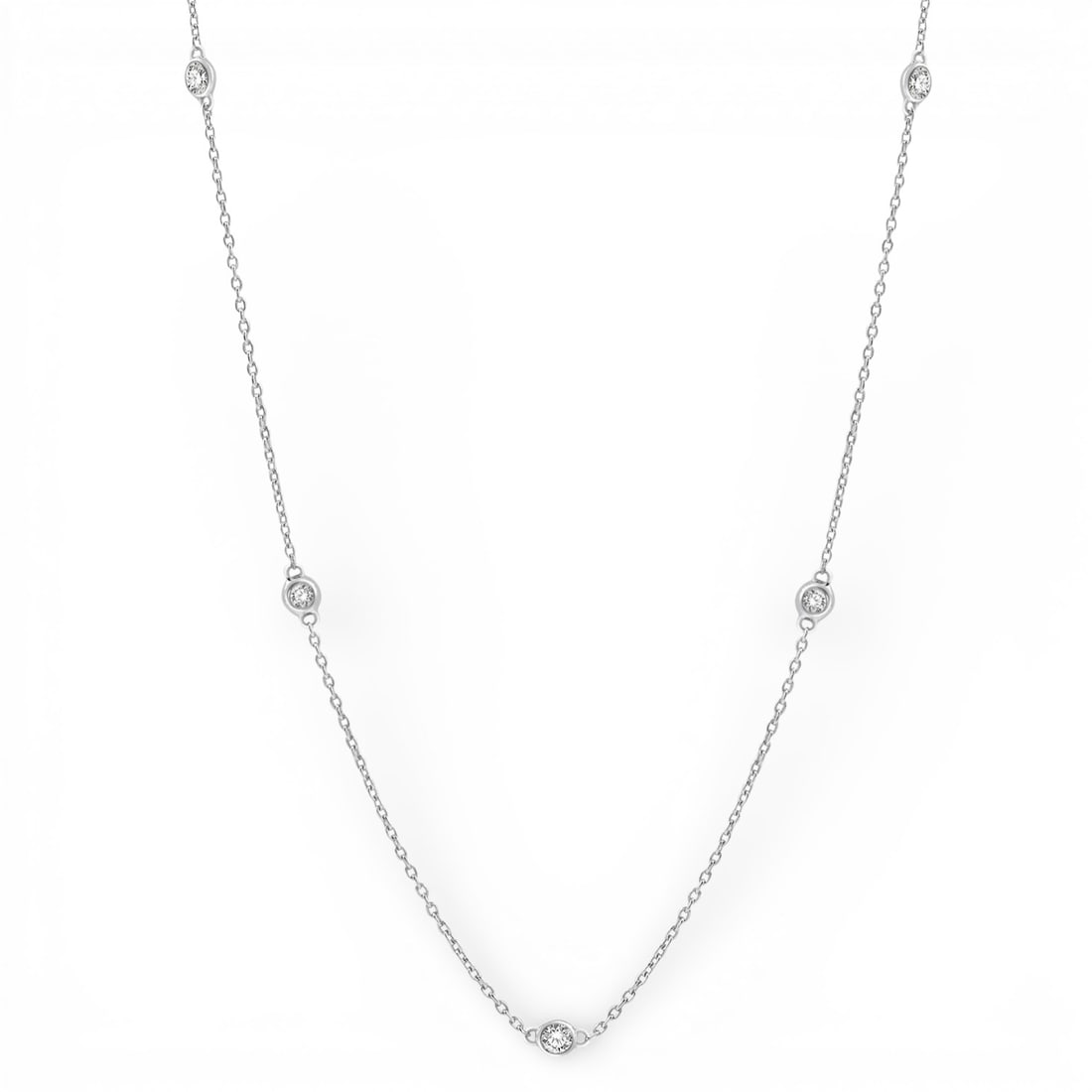 0.50 ctw Round Diamond Station 14K White Gold Necklace: An exquisite masterpiece of haute joaillerie, this elegant Station necklace featuring White Diamond is a true treasure. Crafted with precision, the Station/Bezel setting is seamlessly integrated into 