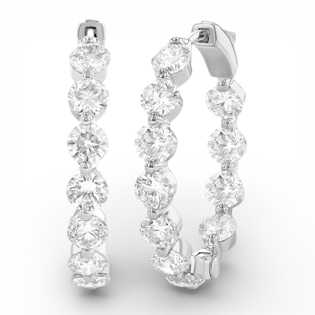 5.06 ctw Diamond 14K White Gold Hoop Earrings: Rare and radiant, this breathtaking Inside-Out Single Prong Set pair of earrings featuring White Diamond offers a touch of the extraordinary. A detailed Hoop gallery secures the stones, rendered in 6.