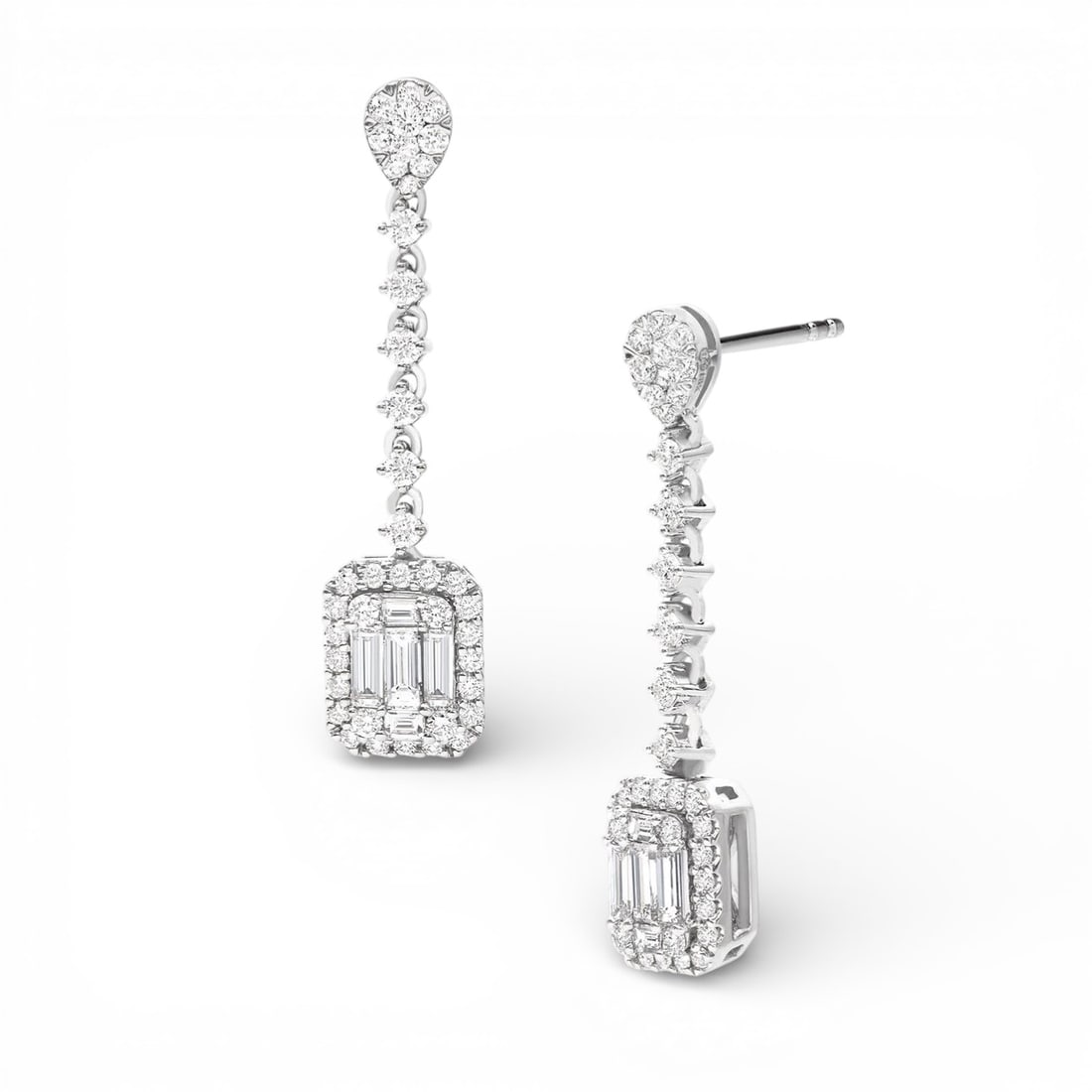 1.44 ctw Baguette and Round Diamond Cluster 18K White Gold Drop Earrings: A symphony of light and color, this elegant Cluster pair of earrings featuring White Diamond embodies the pinnacle of luxury. Expertly mounted in a Cluster setting, the earrings are crafted in 5.65 gr