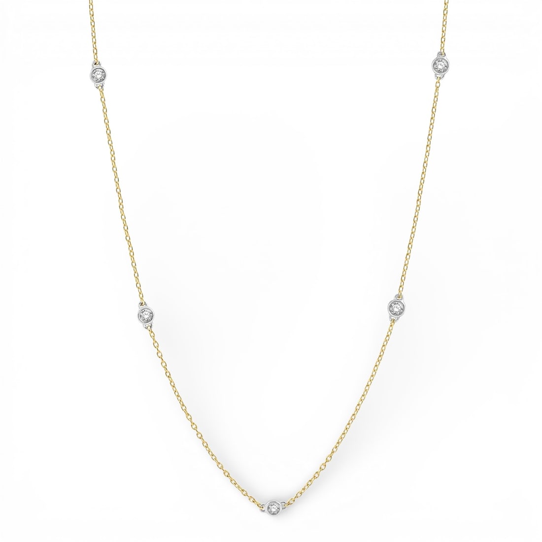 0.76 ctw White Diamond Station 14K Yellow & White Gold Necklace: Rare and radiant, this elegant Station necklace featuring White Diamond offers a touch of the extraordinary. Showcasing the gems in a Station Necklace (Bezel Set) arrangement, the necklace consists of