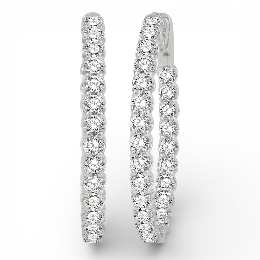 4.0 ctw White Diamond Inside-Out Oval Hoop 14K White Gold Earrings: An exquisite masterpiece of haute joaillerie, this stunning Inside-Out Oval Hoop pair of earrings featuring White Diamond is a true treasure. Crafted with precision, the Inside-Out Hoop setting is sea