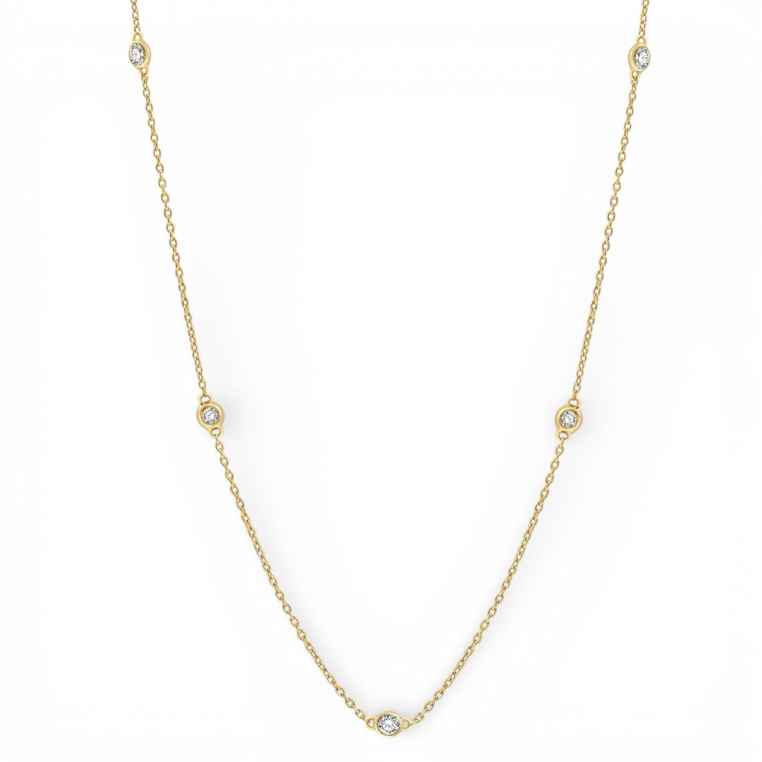 0.25 ctw Round Diamond Station 14K Yellow Gold Necklace: Rare and radiant, this elegant Station necklace featuring Natural Diamonds offers a touch of the extraordinary. A detailed Bezel gallery secures the stones, rendered in 1.9 grams of lustrous 14K Yello