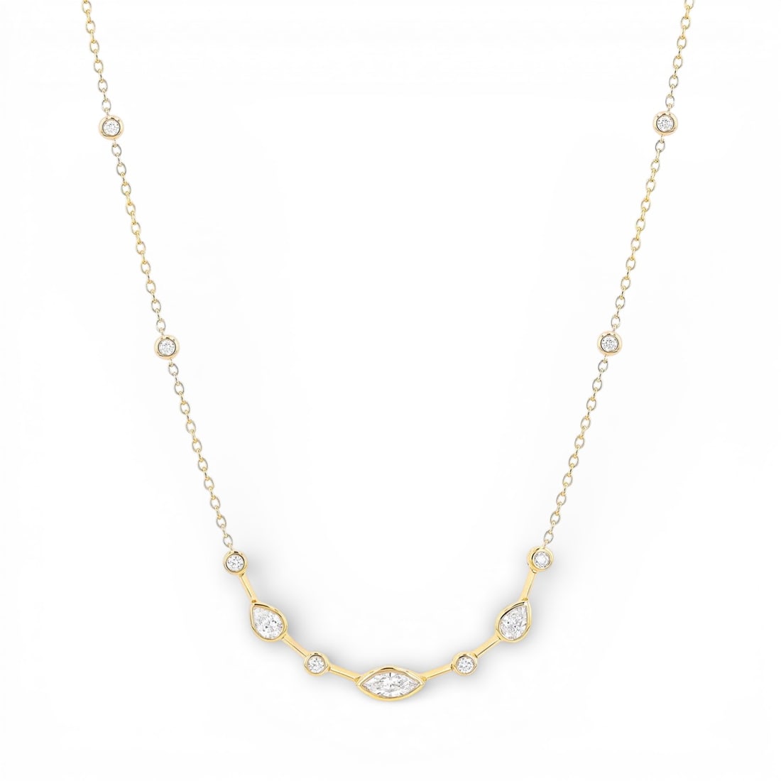 1.15 ctw Marquise Pear Diamond Bezel 18K Yellow Gold Necklace: Epitomizing grandeur, this breathtaking Duchess necklace featuring Natural Diamonds stands as a beacon of refined taste. Crafted with precision, the Festoon setting is seamlessly integrated into 3.4 g