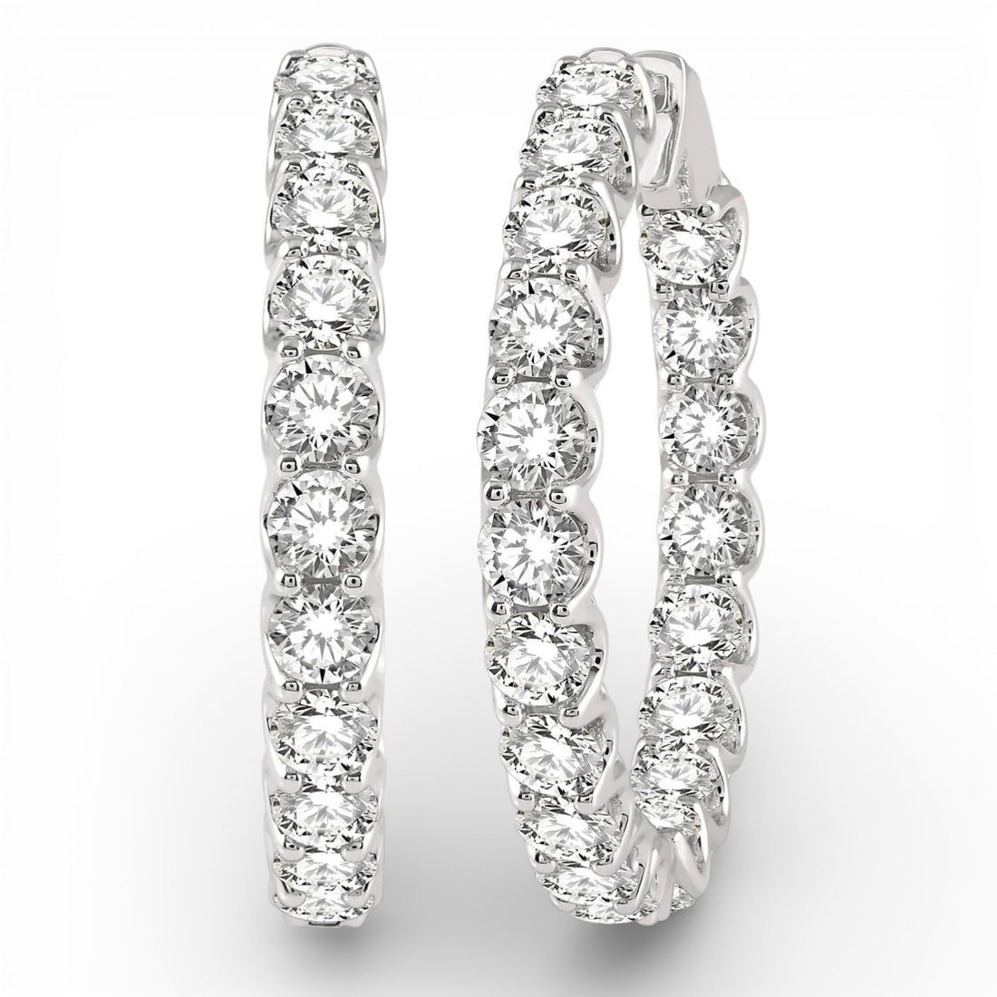 10.0 ctw Round White Diamond Inside-Out Hoop 14K White Gold Earrings: A symphony of light and color, this breathtaking Inside-Out Hoop pair of earrings featuring White Diamond embodies the pinnacle of luxury. Securely held in a classic Hoop design, the earrings are forg