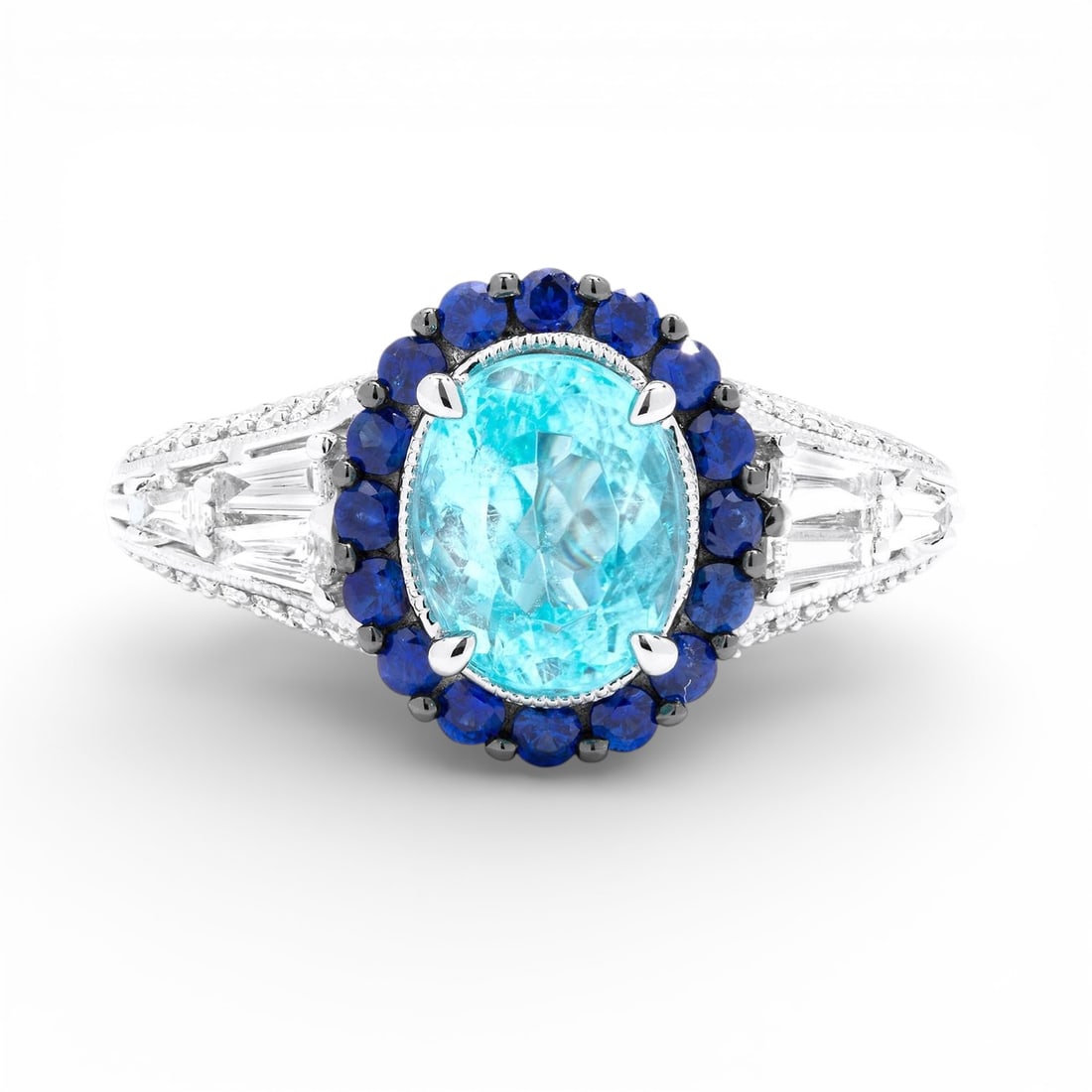 Oval Aquamarine and 0.55 ctw Diamond 18K White Gold Ring: Rare and radiant, this magnificent Halo ring featuring Aquamarine, Blue Sapphire, White Diamond offers a touch of the extraordinary. A detailed Halo gallery secures the stones, rendered in 5.2 grams o