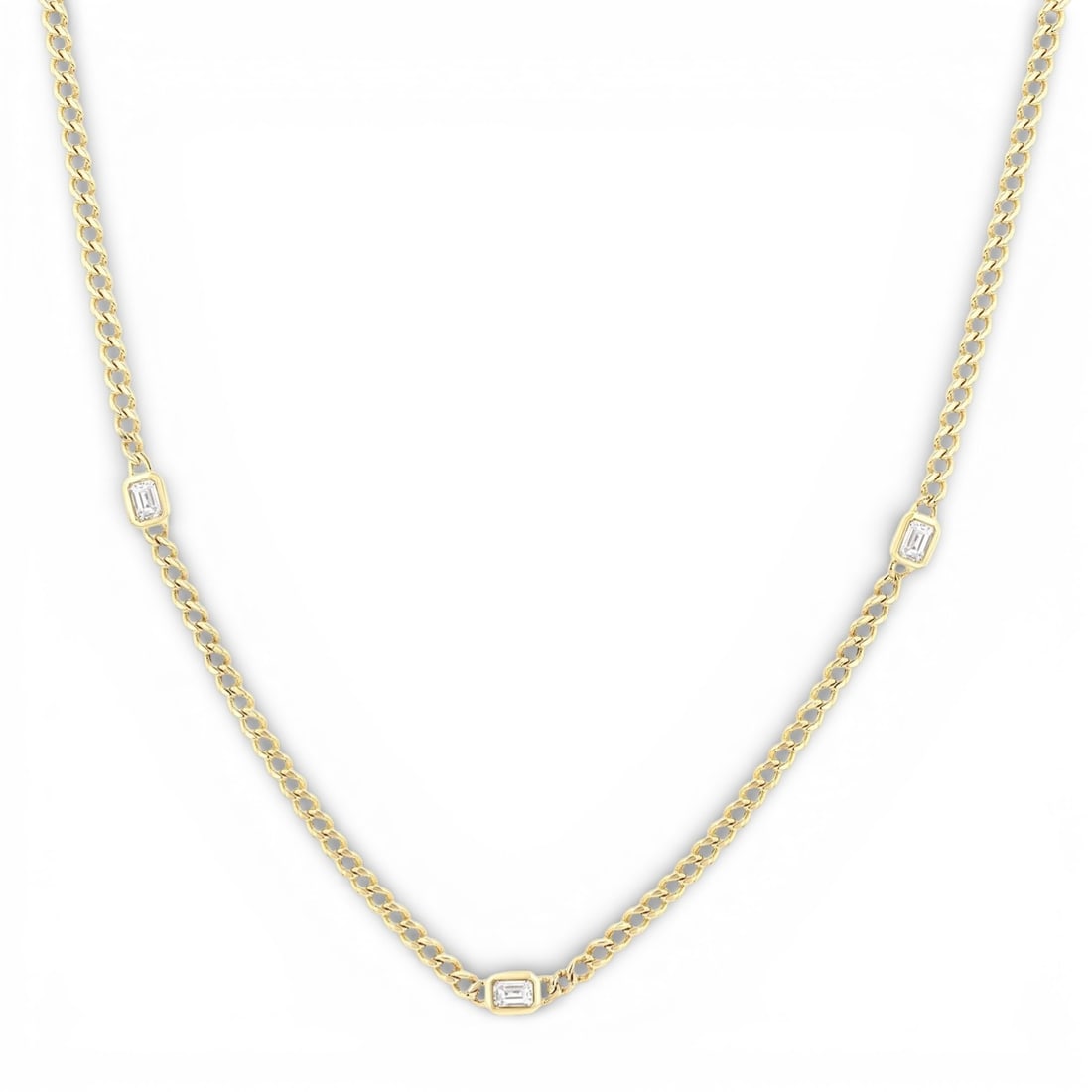 0.50 ctw Emerald Cut Diamond Station Curb Link 14K Yellow Gold Necklace: Epitomizing grandeur, this magnificent Curb Link Station necklace featuring White Diamond stands as a beacon of refined taste. Crafted with precision, the Bezel setting is seamlessly integrated into 1