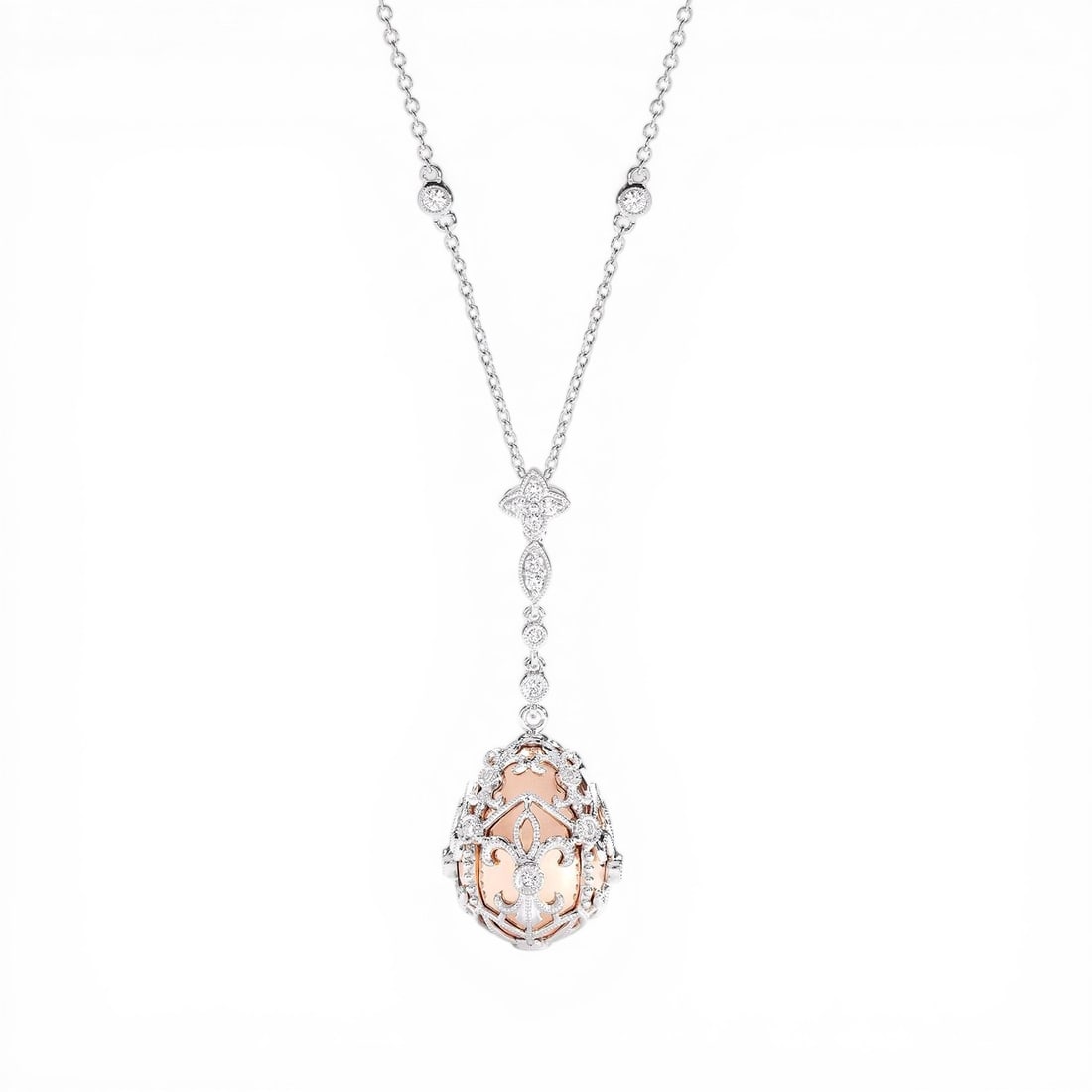 0.59 ctw Diamond Mademoiselle Cage Drop 18K Rose & White Gold Pendant Necklace: An exquisite masterpiece of haute joaillerie, this breathtaking Cage Drop pendant necklace featuring White Diamond is a true treasure. A detailed Drop Pendant gallery secures the stones, rendered in 7