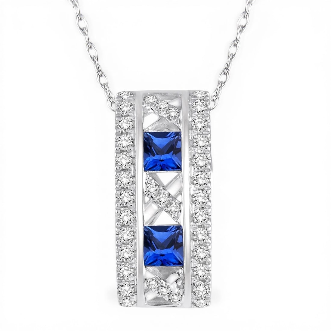 Two 3x3mm Blue Sapphire and 0.21 ctw White Diamond 14K White Gold Pendant: A symphony of light and color, this exquisite Princess Cut pendant featuring Blue Sapphire, White Diamond embodies the pinnacle of luxury. Securely held in a classic Barrel/Cylinder Drop design, the p