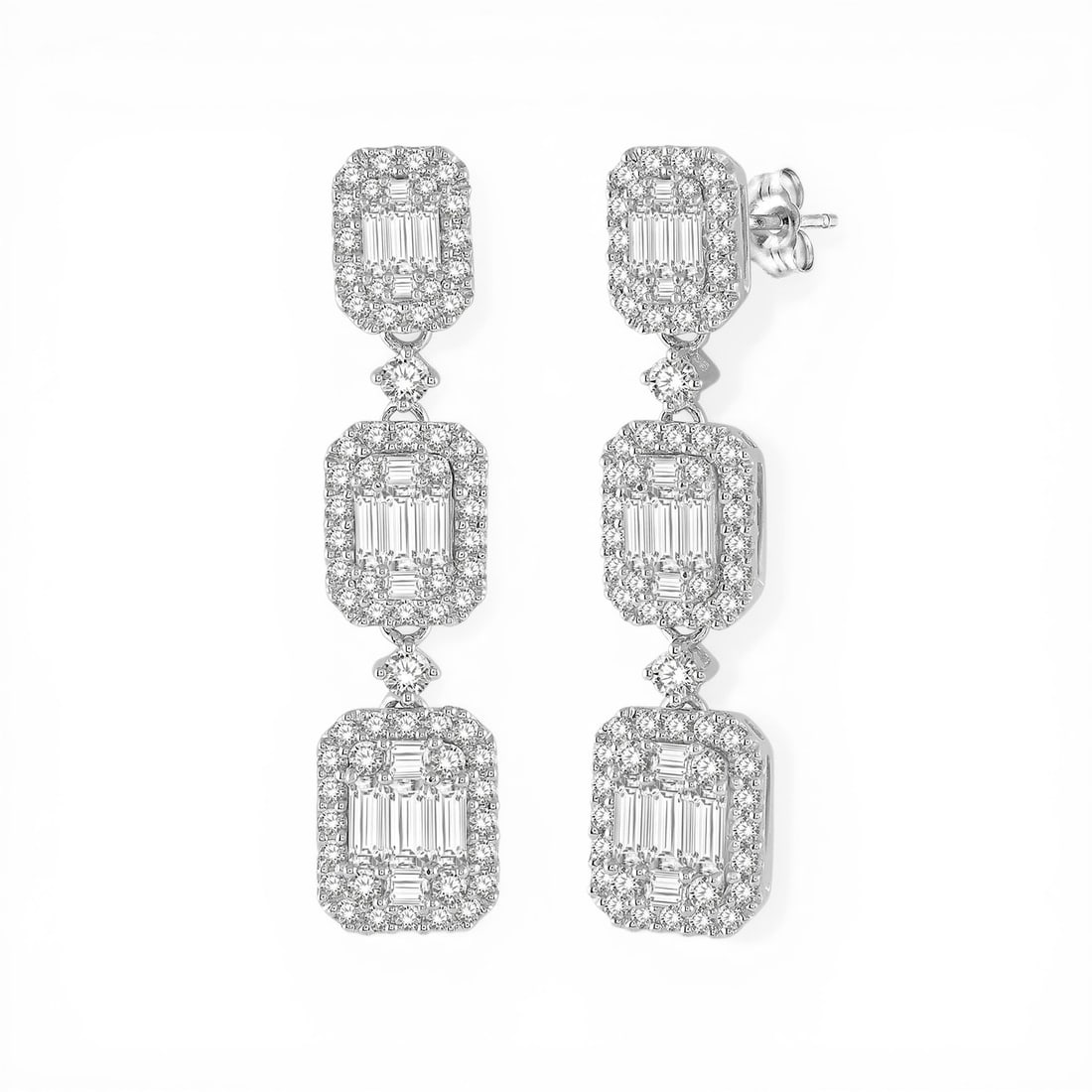 2.11 ctw Baguette and Round Diamond 18K White Gold Earrings: A testament to superior craftsmanship, this exquisite Graduating Station pair of earrings featuring White Diamonds is unparalleled. Showcasing the gems in a Halo arrangement, the earrings consist of 7