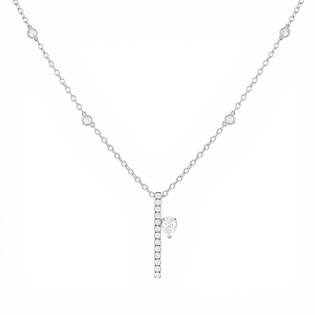 0.71 ctw Pear Diamond Paradox Drift 18K White Gold Pendant Necklace: Epitomizing grandeur, this breathtaking Paradox Drift pendant necklace featuring White Diamond stands as a beacon of refined taste. Showcasing the gems in a Asymmetrical Drop/Bar Pendant arrangement, 