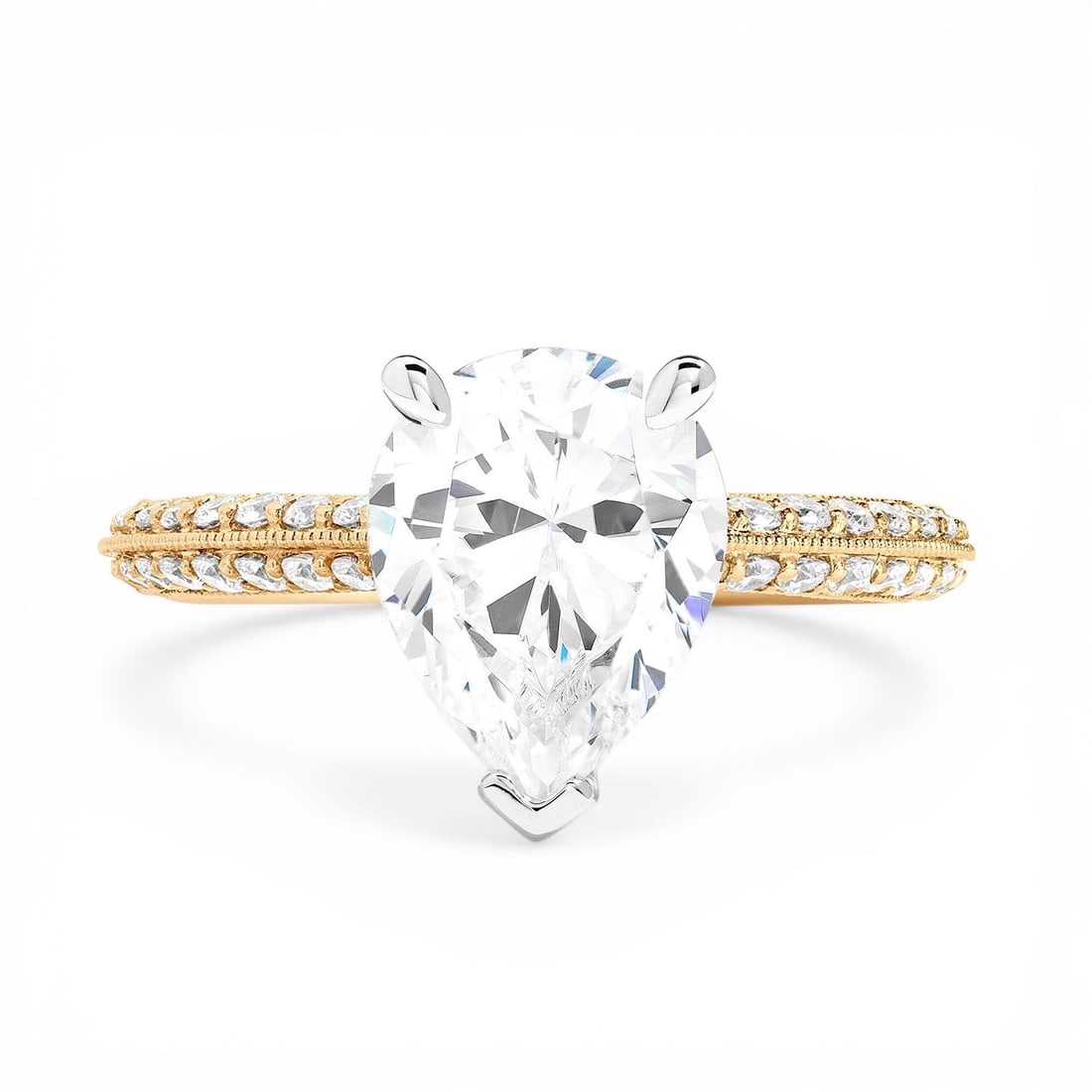 0.64 ctw White Diamond Knife-Edge 14K Yellow & White Gold Engagement Ring: A testament to superior craftsmanship, this breathtaking Knife-Edge Pear ring featuring White Diamond is unparalleled. A detailed Solitaire gallery secures the stones, rendered in 3.75 grams of lustro
