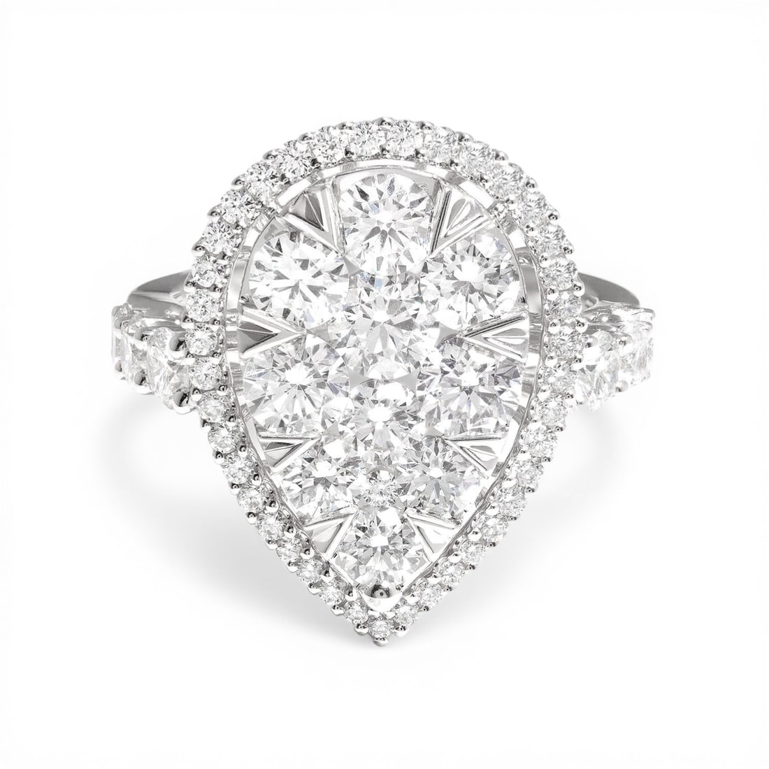 3.21 ctw Diamond 18K White Gold Cocktail Ring: Defining modern elegance, this magnificent Fiori Pear Classic Cluster ring featuring White Diamond captures the essence of style. Expertly mounted in a Halo setting, the ring is crafted in 7.2 grams o
