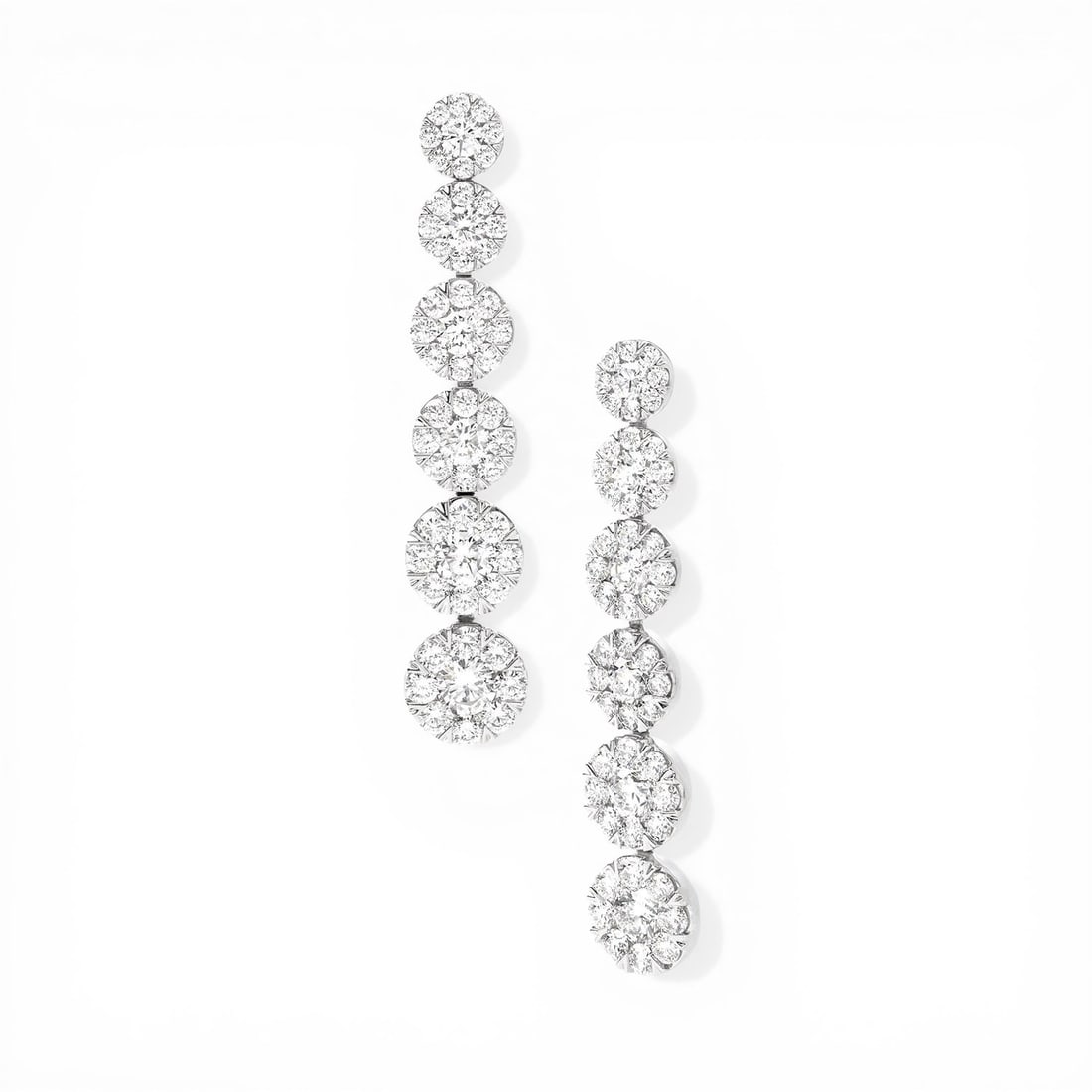 5.23 ctw Fiori White Diamond Cluster 18K White Gold Earrings: Epitomizing grandeur, this magnificent Graduating Drop Cluster pair of earrings featuring White Diamond stands as a beacon of refined taste. Crafted with precision, the Cluster setting is seamlessly i