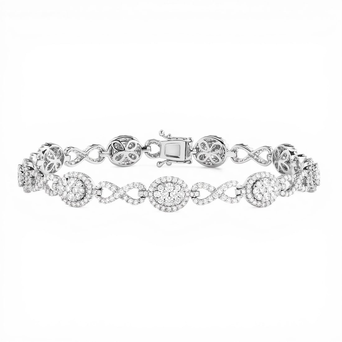 3.06 ctw White Diamond Fiori Infinity Alternating 18K White Gold Bracelet: Defining modern elegance, this breathtaking Fiori Oval And Infinity Alternating bracelet featuring White Diamond captures the essence of style. Expertly mounted in a Cluster setting, the bracelet is c