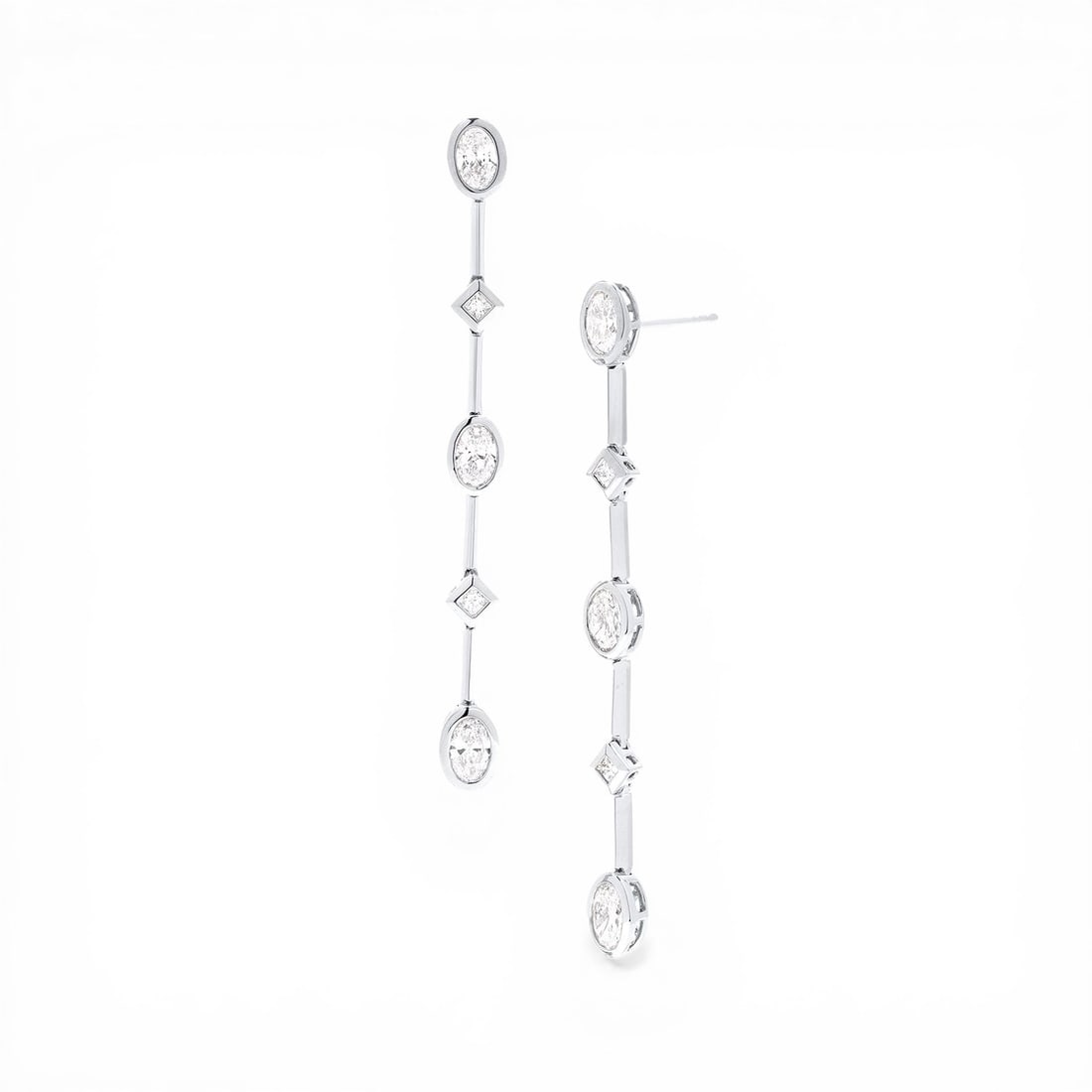 2.04 ctw Oval & Princess Cut Diamond 18K White Gold Drop Earrings: Exuding opulence and grace, this magnificent Bar pair of earrings featuring White Diamond is crafted for the distinguished. Showcasing the gems in a Bar arrangement, the earrings consist of 5.8 grams 