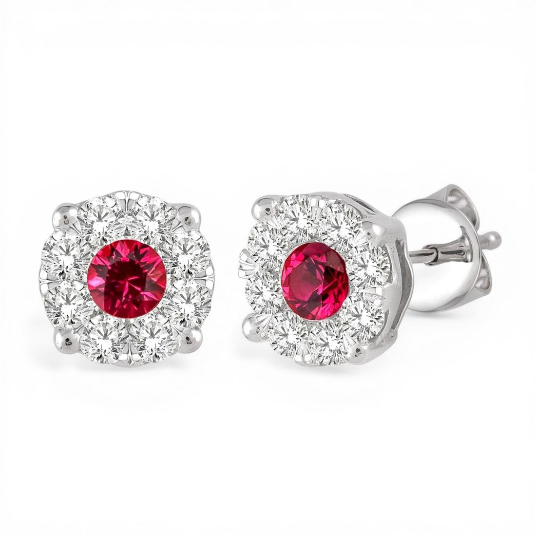 3.3mm Ruby and 0.45 ctw White Diamond 14K White Gold Earrings: Captured in a moment of brilliance, this stunning Cluster pair of earrings featuring Ruby, White Diamond speaks to the connoisseur. The gemstones are nestled within a Cluster framework, supported by a
