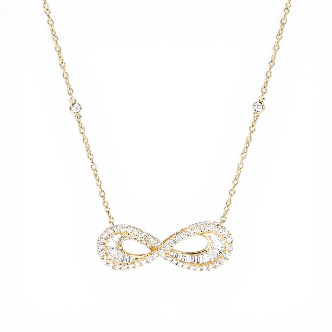 1.68 ctw Diamond Infinity Baguette 18K Yellow Gold Pendant Necklace: Captured in a moment of brilliance, this breathtaking Infinity Baguette necklace featuring White Diamond speaks to the connoisseur. Expertly mounted in a Halo setting, the necklace is crafted in 4.6 g
