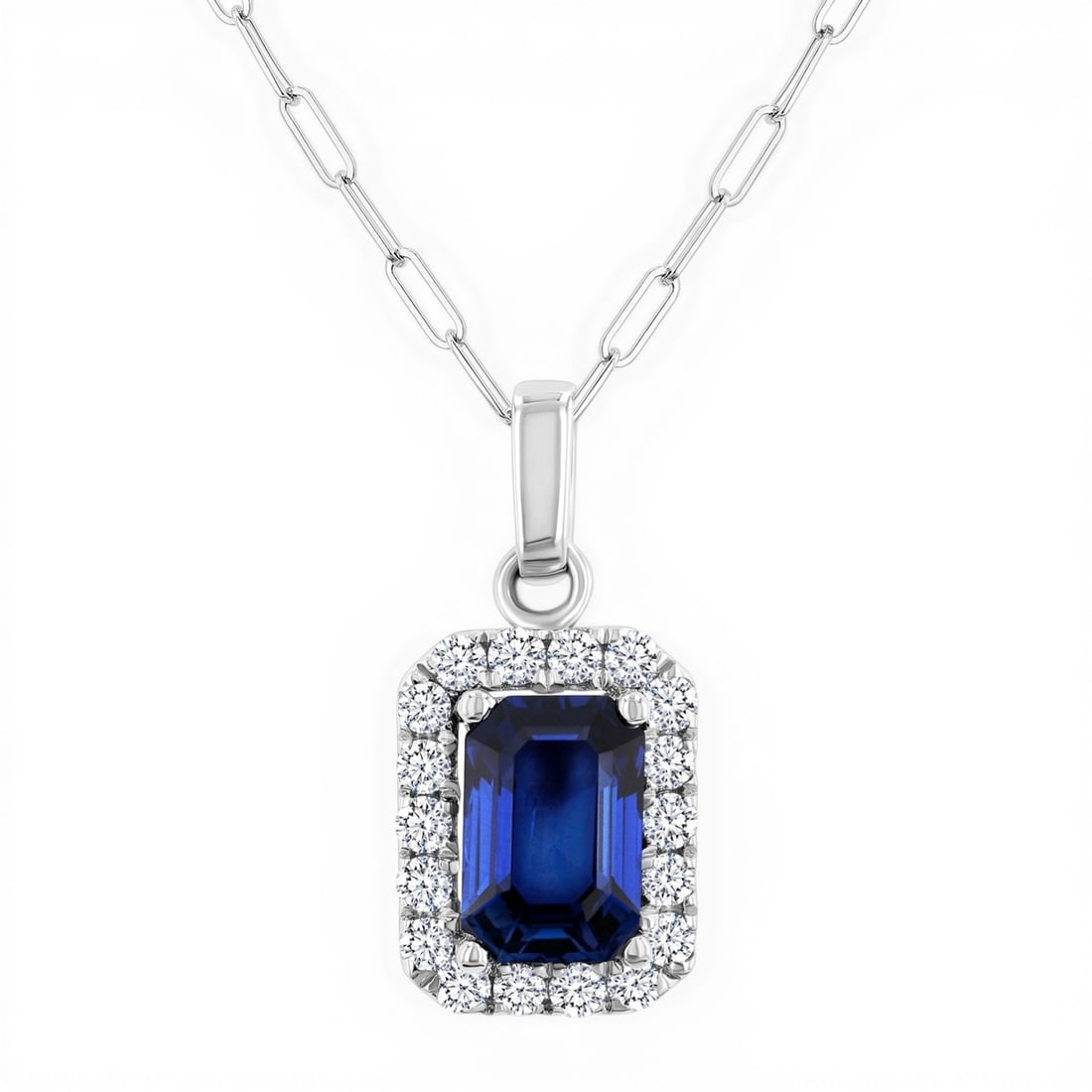 6x4mm Blue Sapphire and 0.15 ctw Diamond 14K White Gold Pendant: A vision of luxury, this elegant Halo pendant featuring Blue Sapphire, White Diamond defines sophistication. Expertly mounted in a Halo setting, the pendant is crafted in 0.6 grams of solid 14K White 