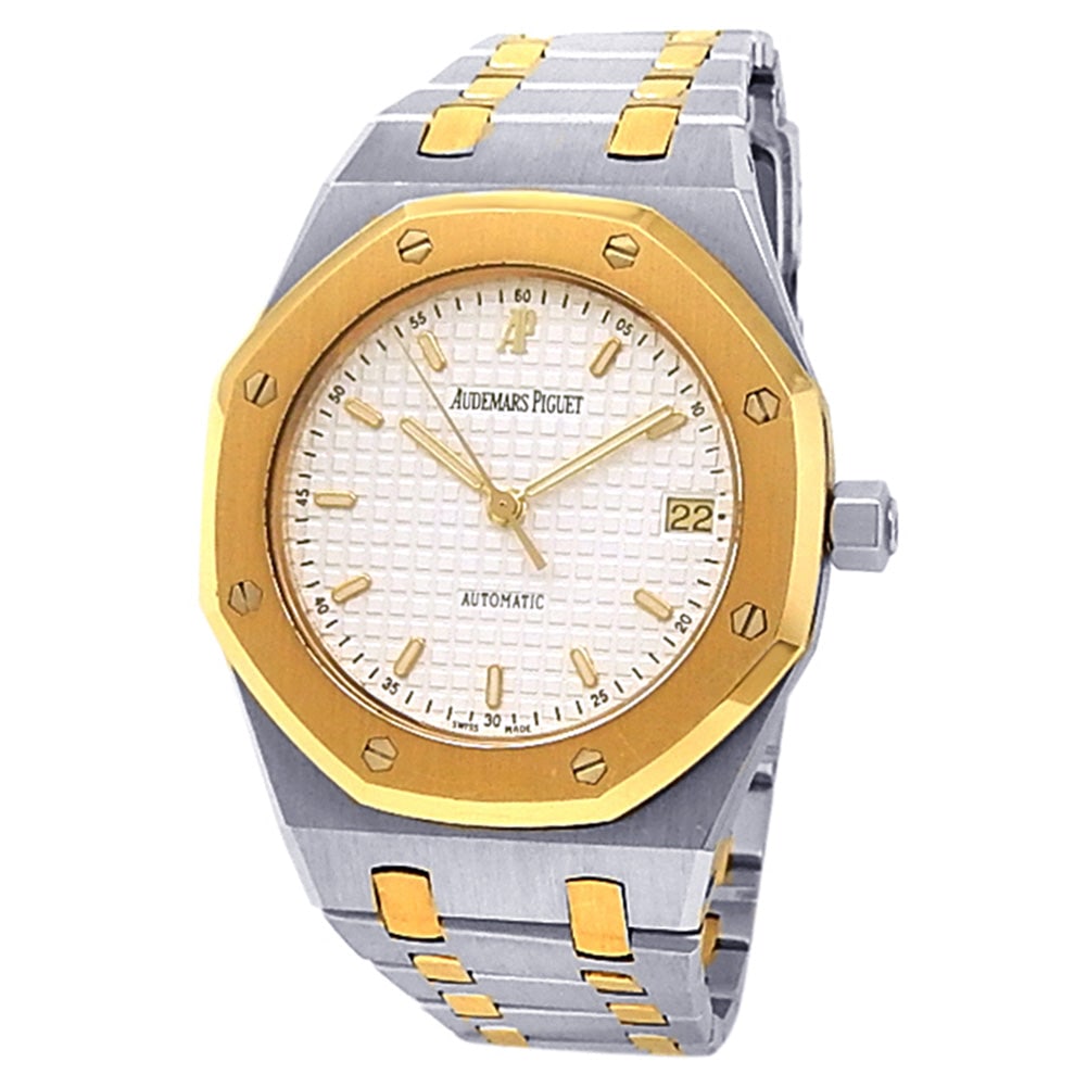 Audemars Piguet Royal Oak 14790SA 18k Yellow Gold & Steel Silver Dial: The Audemars Piguet Royal Oak, reference 14790SA.OO.0789SA.08, is a masterclass in two-tone aesthetics, seamlessly marrying high-grade stainless steel with 18k yellow gold. This 36mm icon features the