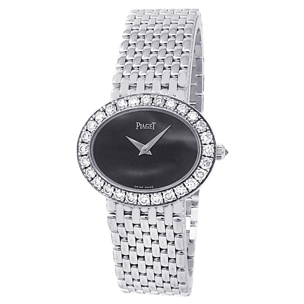 Piaget Vintage P10214 18k White Gold Diamond Bezel Black Dial: This elegant Piaget Vintage Ref. P10214 represents the pinnacle of mid-century inspired luxury and Swiss artistry. The timepiece is exquisitely crafted from 18k white gold, featuring a minimalist blac