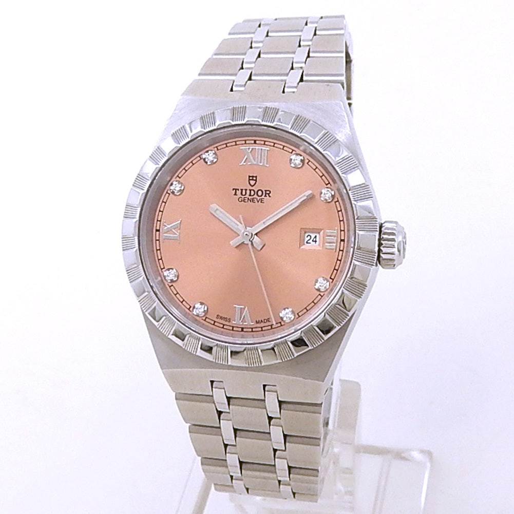 Tudor Royal M28300-0010 Stainless Steel Salmon Diamond Dial: The Tudor Royal M28300-0010 represents a sophisticated fusion of classic elegance and technical reliability. This 28mm timepiece is meticulously crafted from durable stainless steel, featuring a disti
