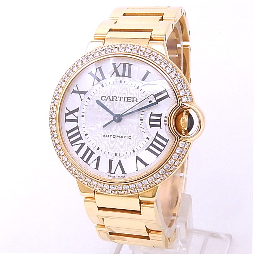 Cartier Ballon Bleu WE9004Z3 18k Yellow Gold Diamond Bezel Silver Dial: The Cartier Ballon Bleu, reference WE9004Z3, represents a masterful blend of technical precision and ethereal design. This stunning timepiece features a solid 18k yellow gold case, further elevated by