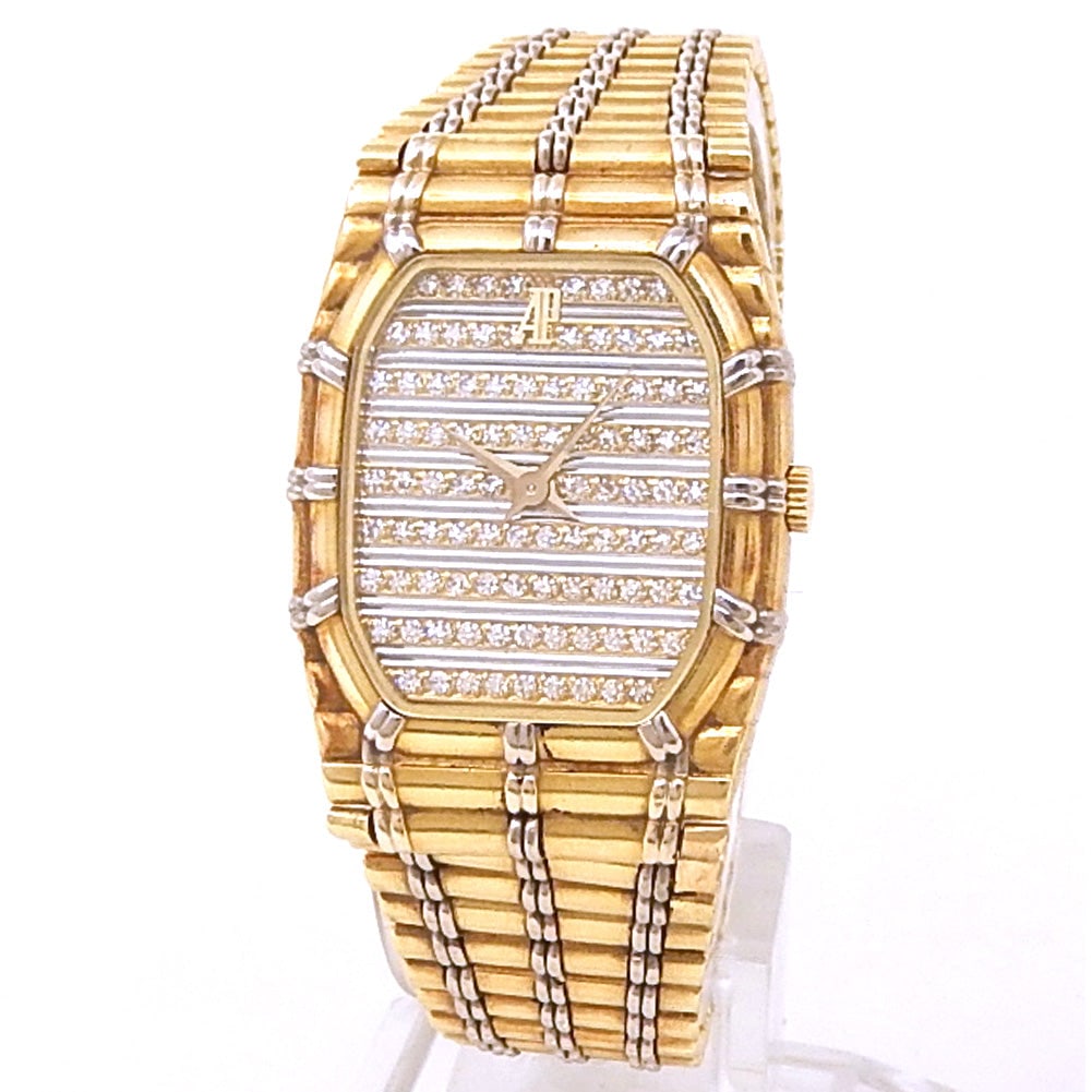 Audemars Piguet Bamboo 18k Yellow and White Gold Diamonds Pave Dial: Representing a pinnacle of sculptural elegance, this Audemars Piguet Bamboo is a masterclass in textures and precious materials. The distinctive case, crafted from a harmonious blend of 18k Yellow Gol