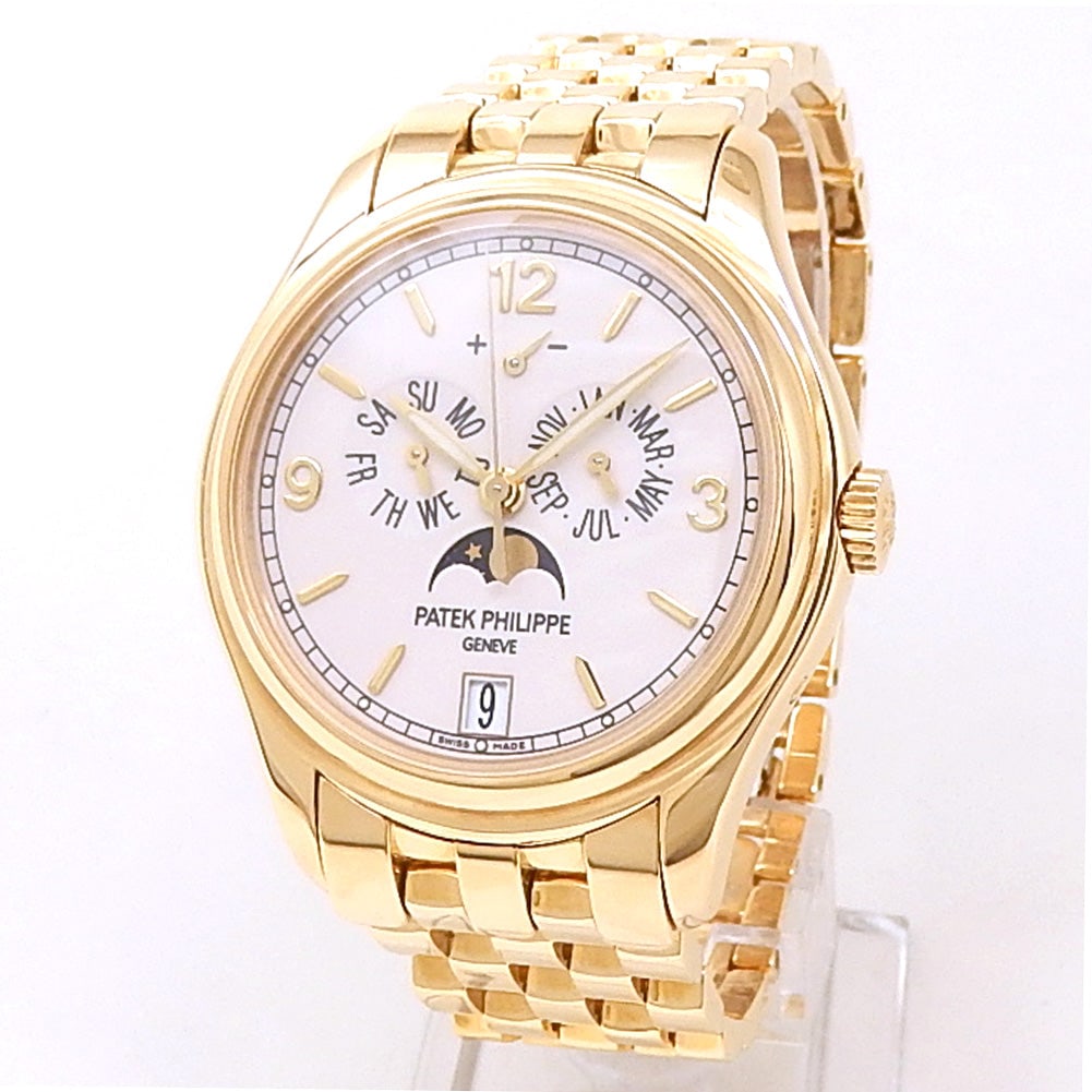 Patek Philippe Complications Annual Calendar 5146/1J-001 18k Yellow Gold Cream Dial: The Patek Philippe Complications Annual Calendar, Reference 5146/1J-001, is an enduring icon of horological sophistication and technical prowess. Expertly crafted in 18k yellow gold, this timepiece fe