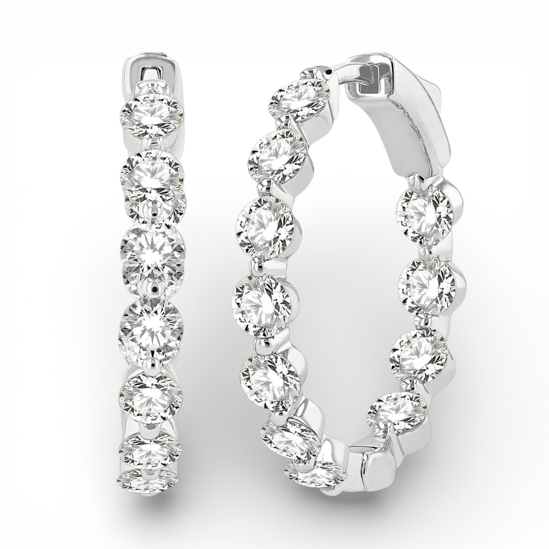 3.03 ctw Inside-Out Round Diamond 14K White Gold Hoop Earrings: Captured in a moment of brilliance, this stunning Inside-Out pair of earrings featuring White Diamond speaks to the connoisseur. Expertly mounted in a Line Setting setting, the earrings are crafted in