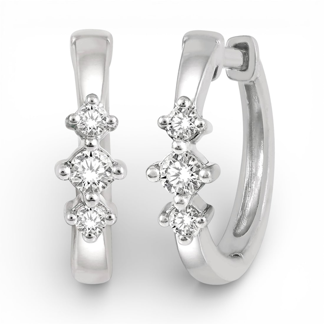 0.15 ctw Diamond Three Stone 10K White Gold Huggie Earrings: A symphony of light and color, this stunning Three Stone pair of earrings featuring White Diamond embodies the pinnacle of luxury. Securely held in a classic Three-Stone design, the earrings are forge