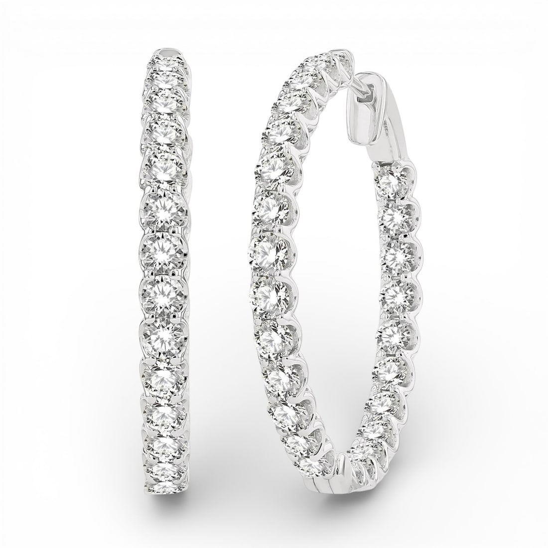 5.00 ctw Inside-Out White Diamond 14K White Gold Hoop Earrings: A vision of luxury, this stunning Inside-Out Hoop pair of earrings featuring White Diamond defines sophistication. The gemstones are nestled within a Continuous Line Hoop framework, supported by a sub