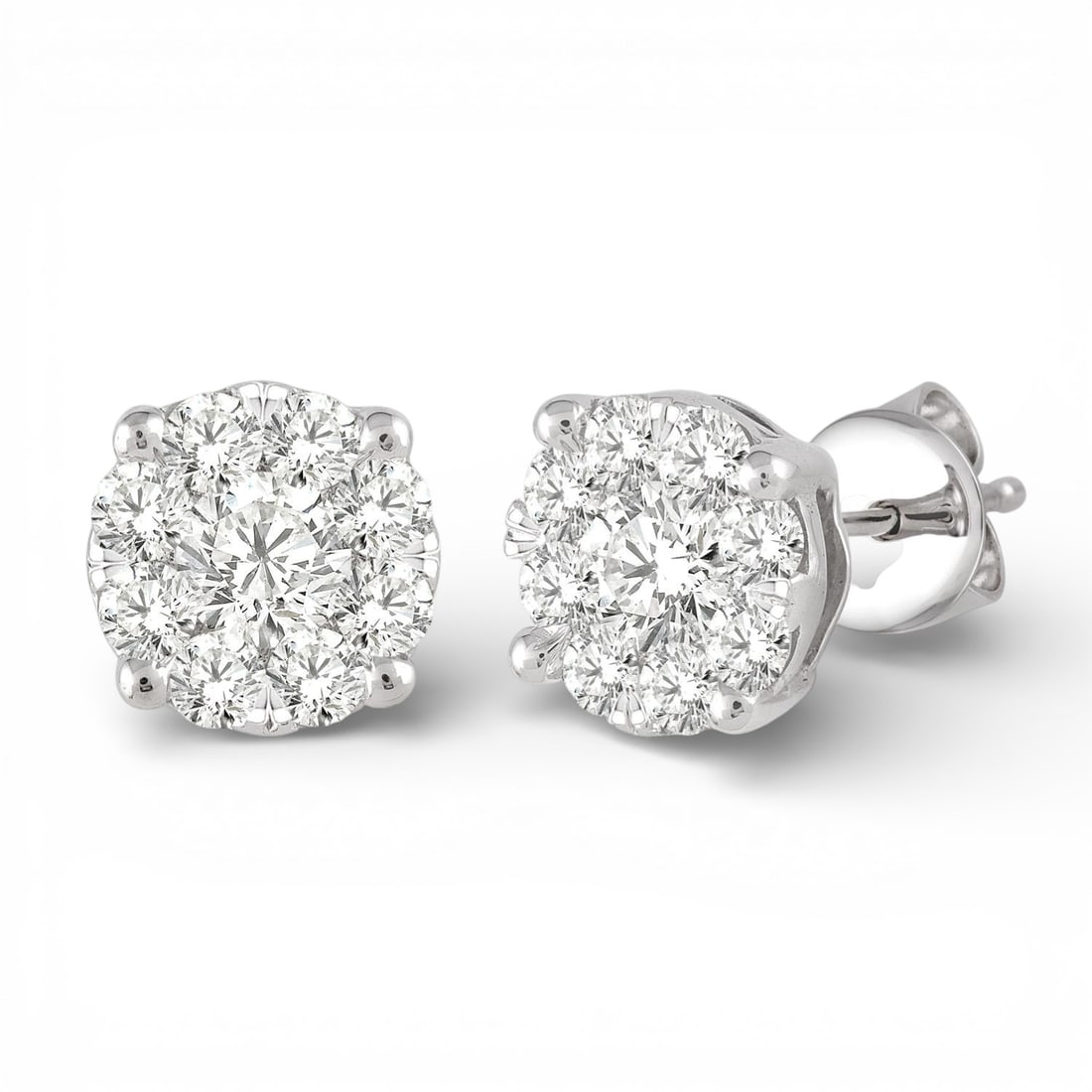 1.04 ctw White Diamond Cluster 14K White Gold Stud Earrings: Captured in a moment of brilliance, this stunning Cluster pair of earrings featuring Natural Diamonds speaks to the connoisseur. Expertly mounted in a Cluster setting, the earrings are crafted in 2.75
