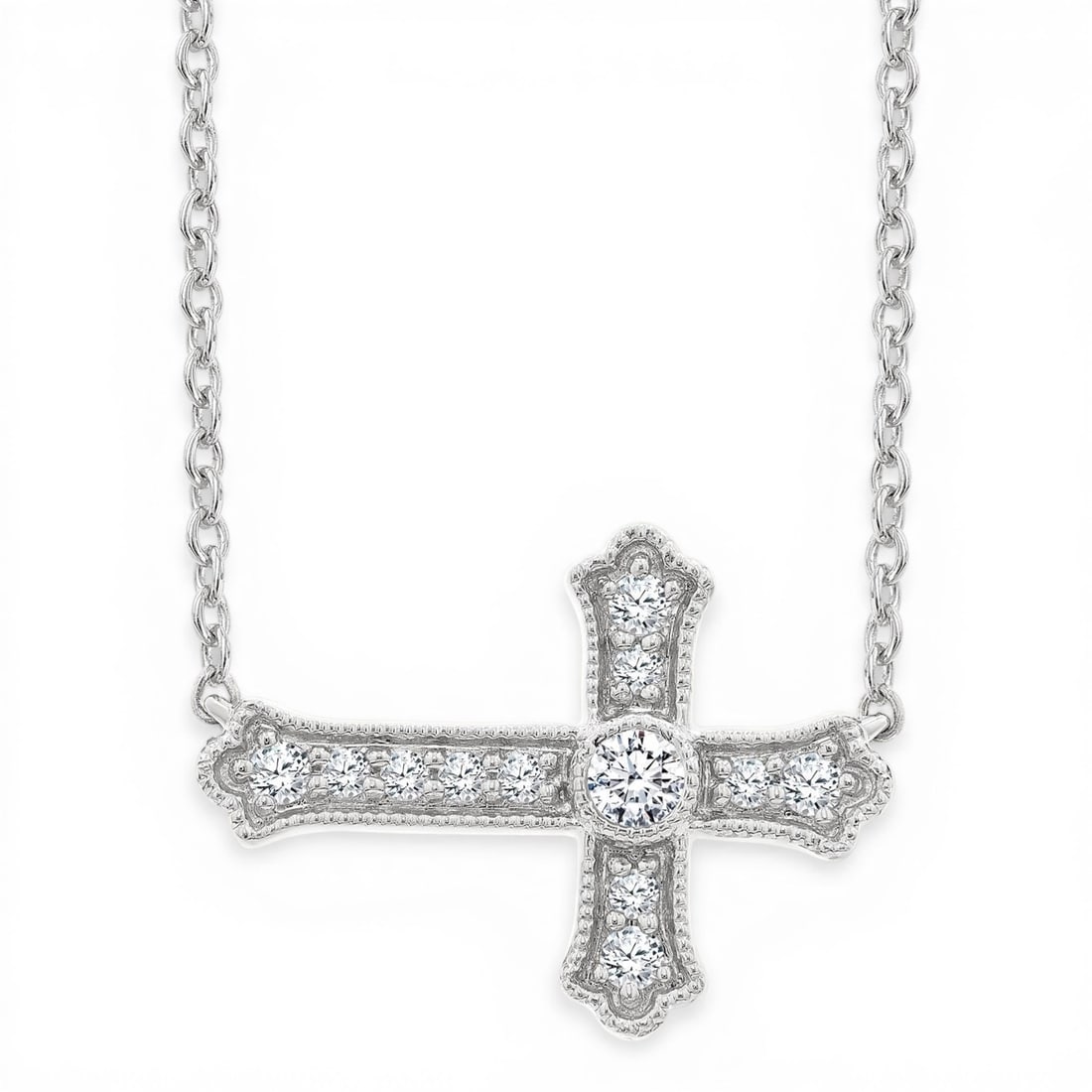 0.12 ctw Diamond Sideway Cross 10K White Gold Pendant Necklace: Timeless and sophisticated, this elegant Sideway Cross pendant necklace featuring White Diamond radiates enduring beauty. The gemstones are nestled within a Bezel and Pave set pendant with Milgrain de