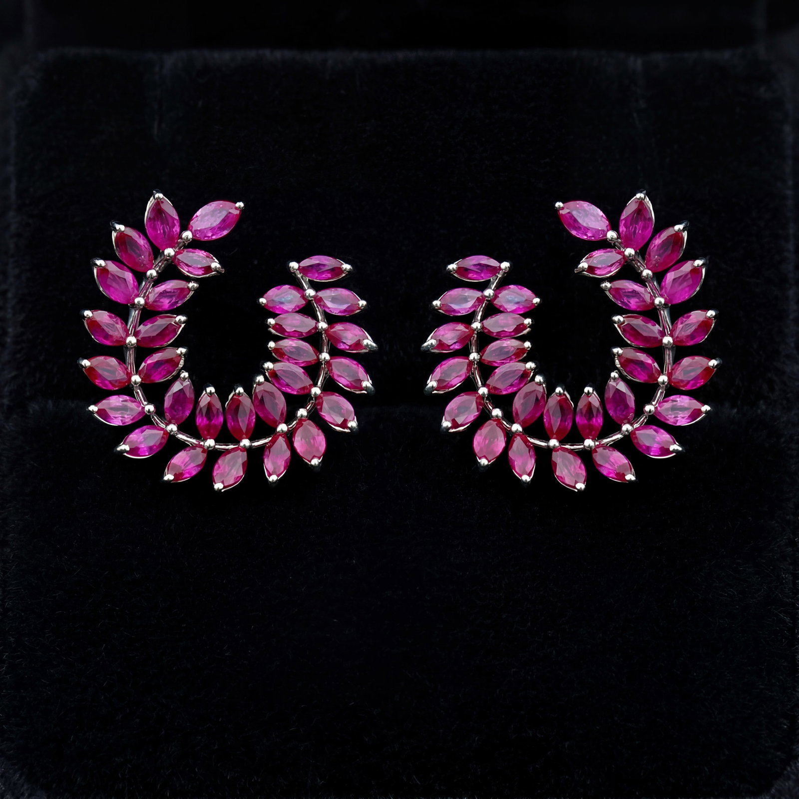 6.7 ctw Ruby Leaf Platinum Earrings: Retail Value: $9,345 Captured in a moment of brilliance, this stunning Leaf pair of earrings featuring Ruby speaks to the connoisseur. Expertly mounted in a Cluster setting, the earrings are crafted i