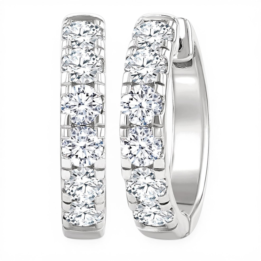 1.50 ctw Round Diamond Hoop 14K White Gold Earrings: Rare and radiant, this breathtaking Hoop pair of earrings featuring White Diamond offers a touch of the extraordinary. A detailed Hoop gallery secures the stones, rendered in 6.1 grams of lustrous 14K