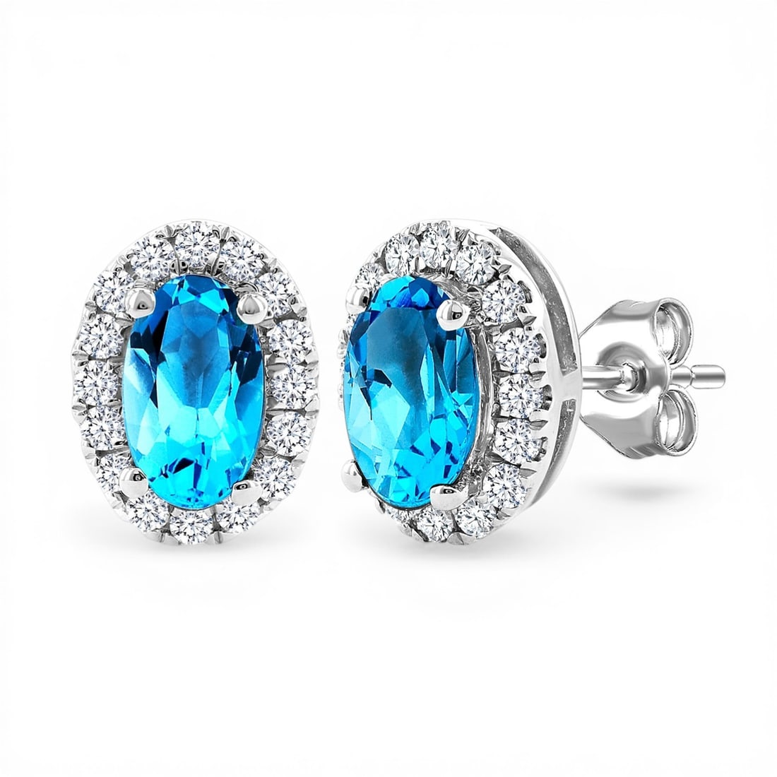 5x3mm Blue Topaz and 0.14 ctw Diamond 14K White Gold Stud Earrings: Defining modern elegance, this elegant Halo pair of earrings featuring Blue Topaz, White Diamond captures the essence of style. Expertly mounted in a Halo setting, the earrings are crafted in 0.85 gra