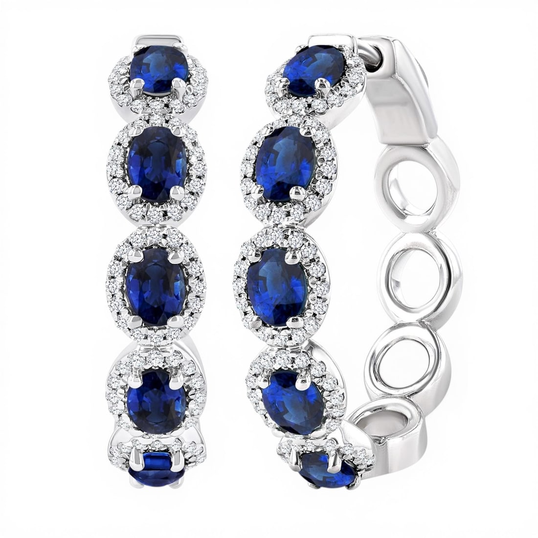 4x3 mm Oval Sapphire and 0.49 ctw Diamond 14K White Gold Hoop Earrings: Defining modern elegance, this stunning Halo pair of earrings featuring Sapphire, White Diamond captures the essence of style. Expertly mounted in a Halo setting, the earrings are crafted in 8.6 grams