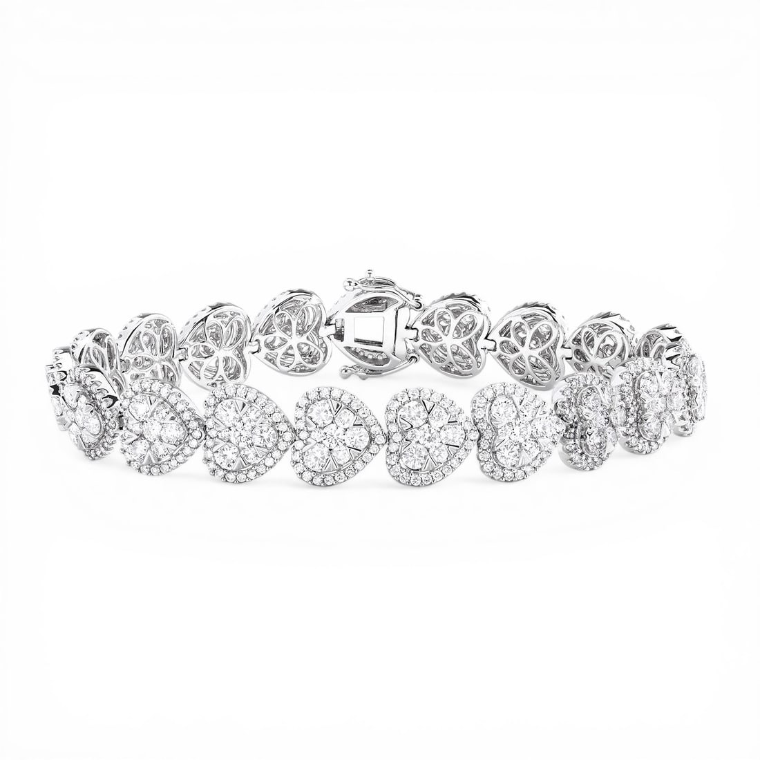 7.75 ctw Fiori Heart Diamond 18k White Gold Tennis Bracelet: Retail Value: $43,125 A vision of luxury, this exquisite Fiori Heart tennis bracelet featuring White Diamond defines sophistication. A detailed Cluster gallery secures the stones, rendered in 21.4 g o