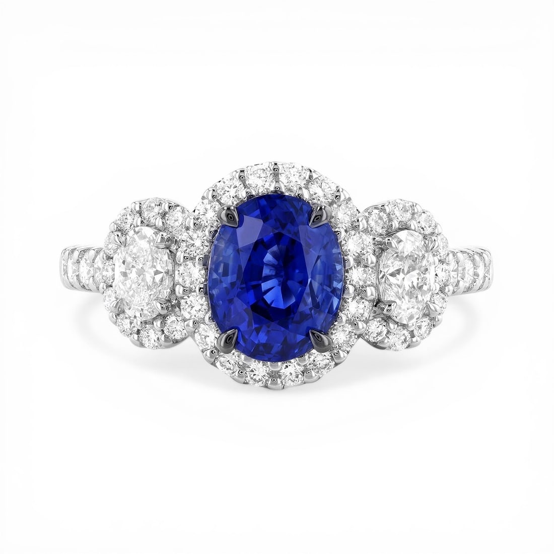 Oval Blue Sapphire and 1.02 ctw White Diamond 18K White Gold Ring: Retail Value: $24,165 A vision of luxury, this exquisite Three-Stone ring featuring Blue Sapphire, White Diamond defines sophistication. Showcasing the gems in a Three-Stone (with Halo) arrangement, t