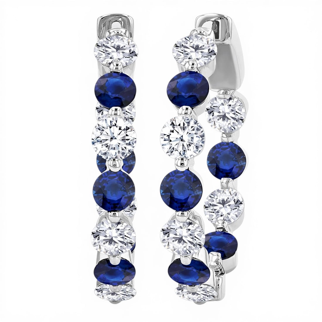 3.3mm Sapphire and 1.68 ctw Diamond Inside-Out 14K White Gold Hoop Earrings: A symphony of light and color, this breathtaking Inside-Out Alternating Hoop pair of earrings featuring Blue Sapphire, White Diamond embodies the pinnacle of luxury. Securely held in a classic Shared 