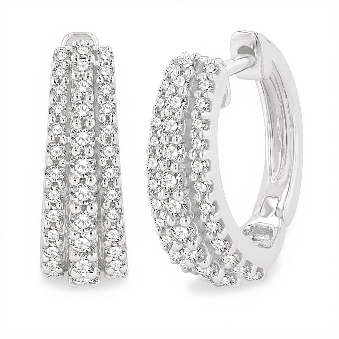 0.52 ctw White Diamond Triple Row 14K White Gold Huggie Earrings: A vision of luxury, this stunning Triple Row pair of earrings featuring Natural Diamonds defines sophistication. Expertly mounted in a Shared Prong setting, the earrings are crafted in 3.4 grams of so