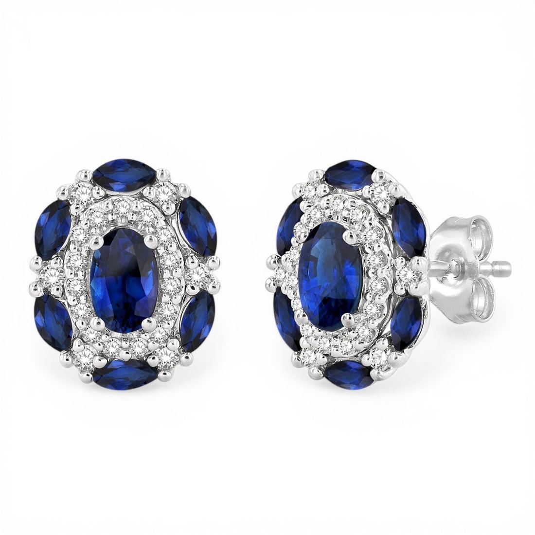 5x3mm Oval Blue Sapphire and 0.20 ctw Diamond 14K White Gold Earrings: Defining modern elegance, this stunning Halo pair of earrings featuring Blue Sapphire, White Diamond captures the essence of style. Expertly mounted in a Halo setting, the earrings are crafted in 2.1 